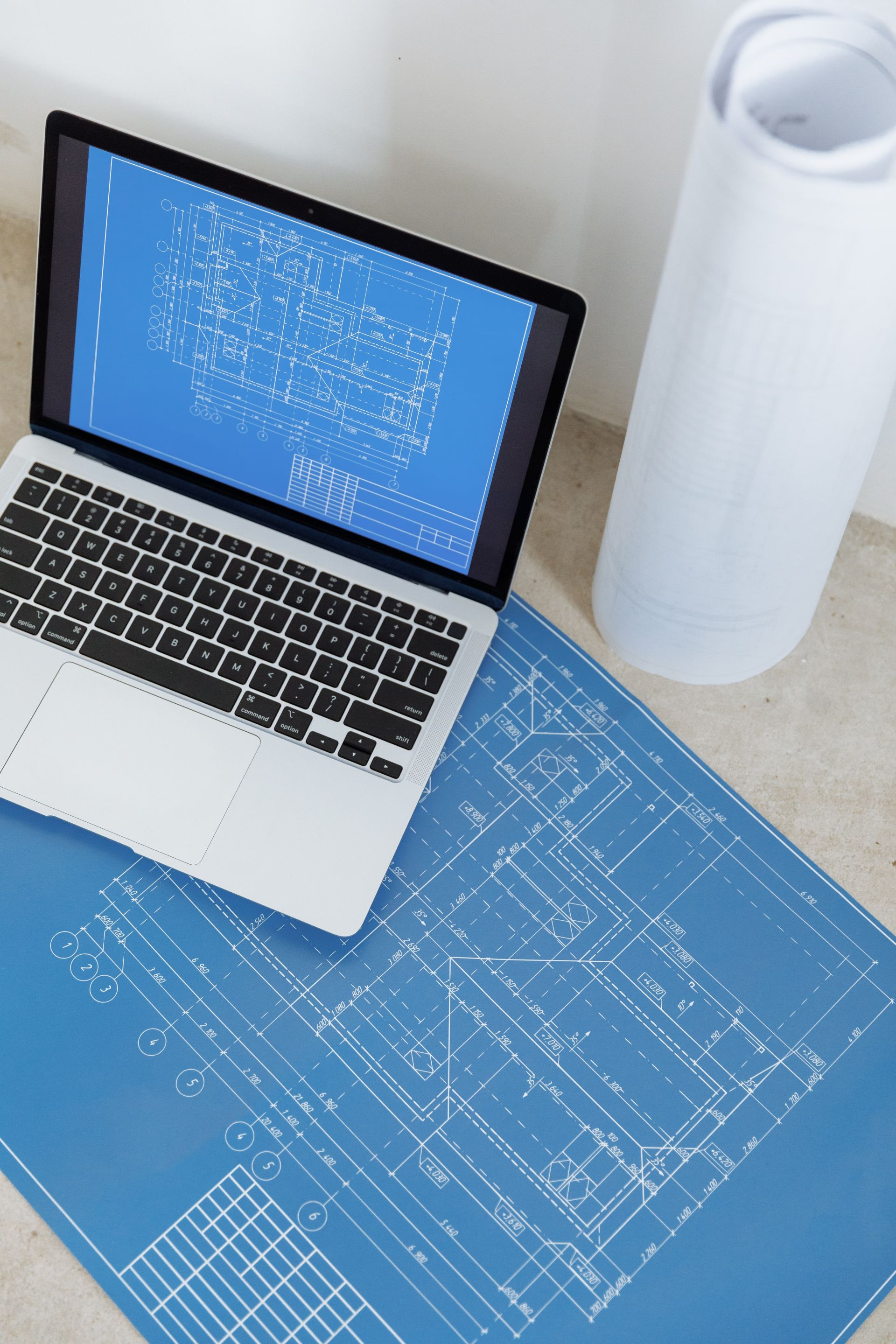 Laptop on blueprints