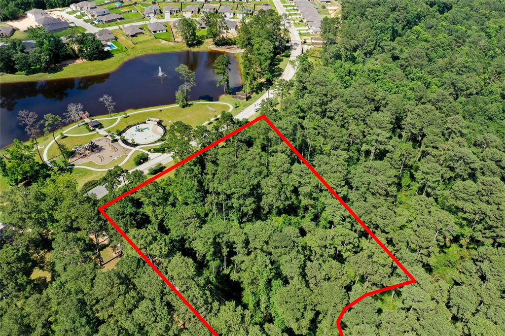 Aerial view of land beside completed housing development
