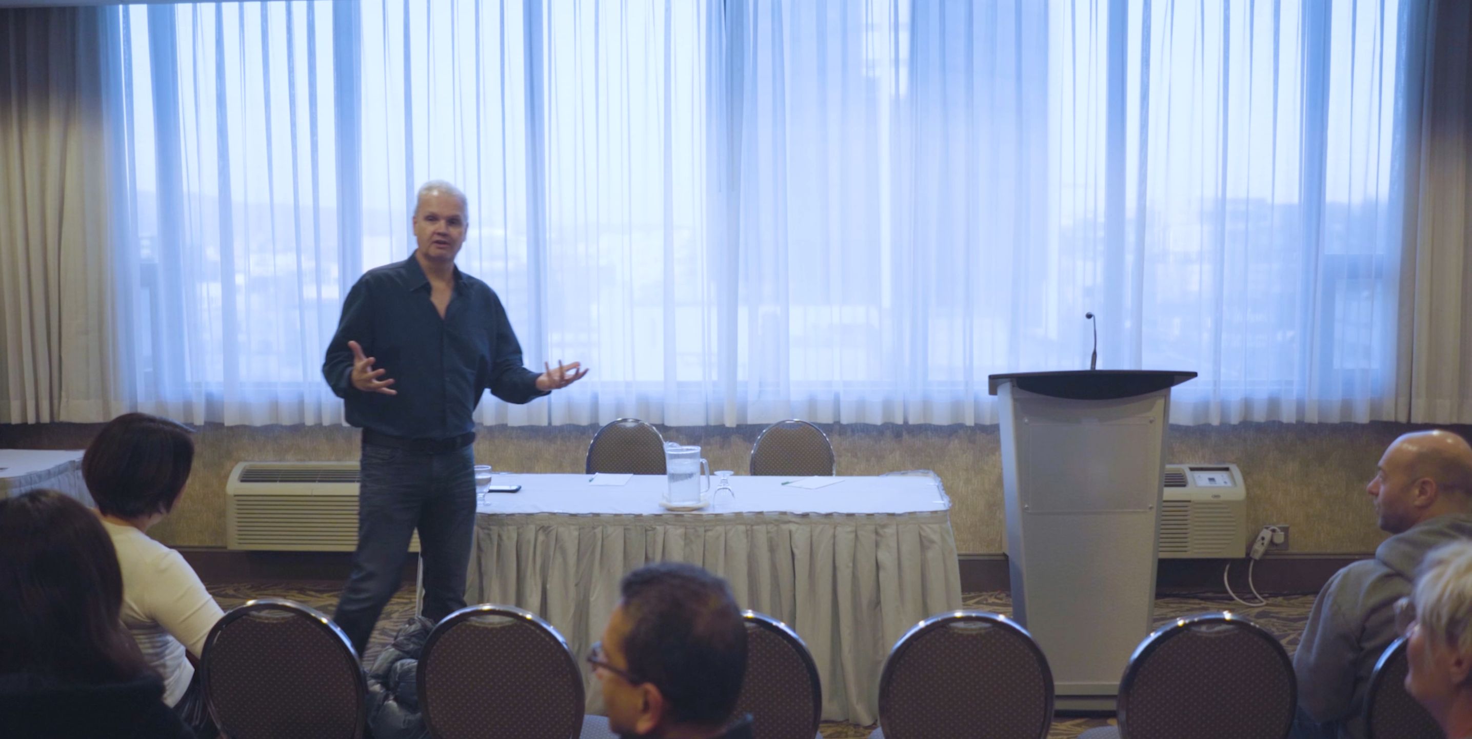 Darcy Marler speaking at a conference